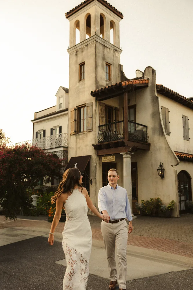 Alexandra and Dalton walking beside a historic building