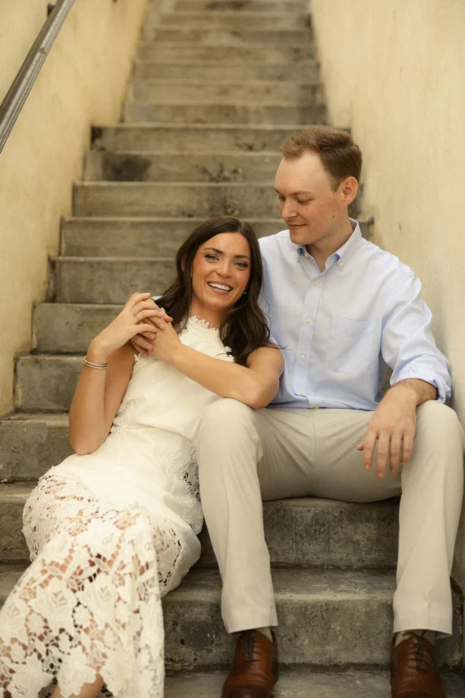 Alexandra and Dalton sitting together on stone steps