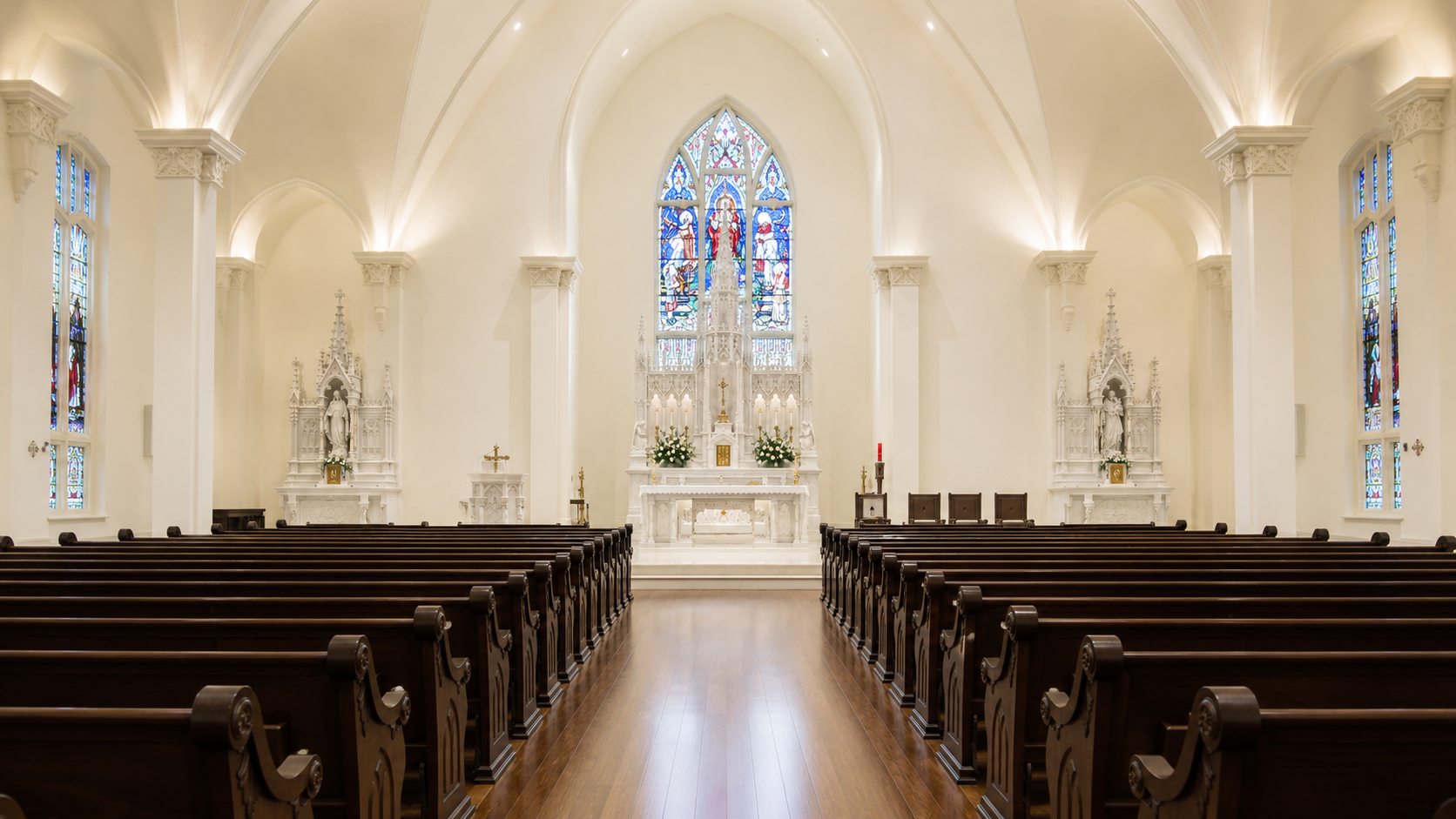 Interior of St. Ignatius Catholic Church facing the altar and stained glass